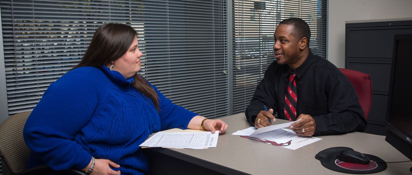 Supervisor reviewing a performance evaluation with their employee.