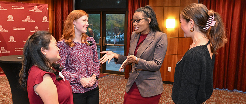 alumni engage in conversation at networking night