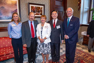 Hui Wang receiving the 2019 Governor's Young Scientist Award for Excellence in Scientific Research by South Carolina Governor Henry McMaster at the Statehouse.