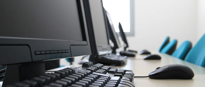 a bank of computers in a classroom