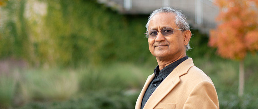 Amit Sheth stands in the courtyard.