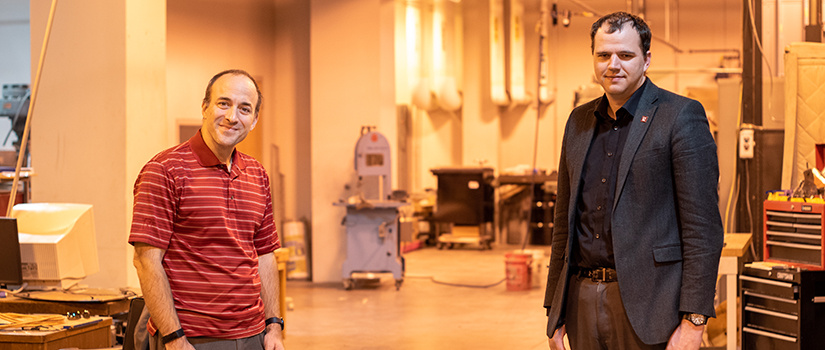 Bakos and Downey stand in their lab.