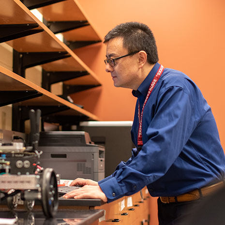 Professor Wang working in the lab