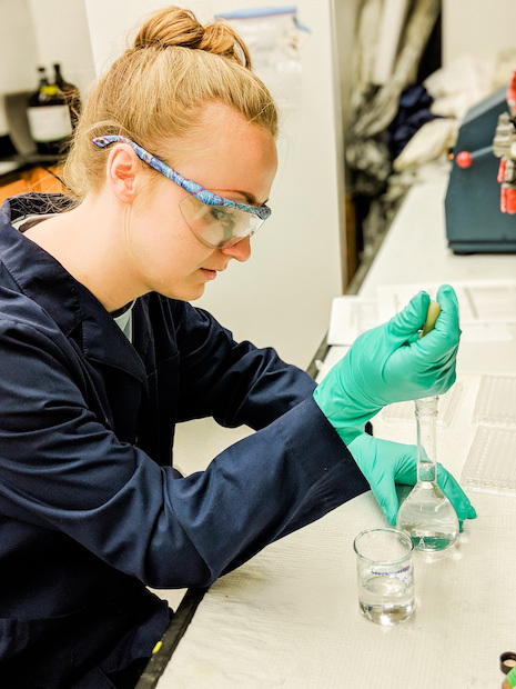 Gretchen Bollar conducts research in lab