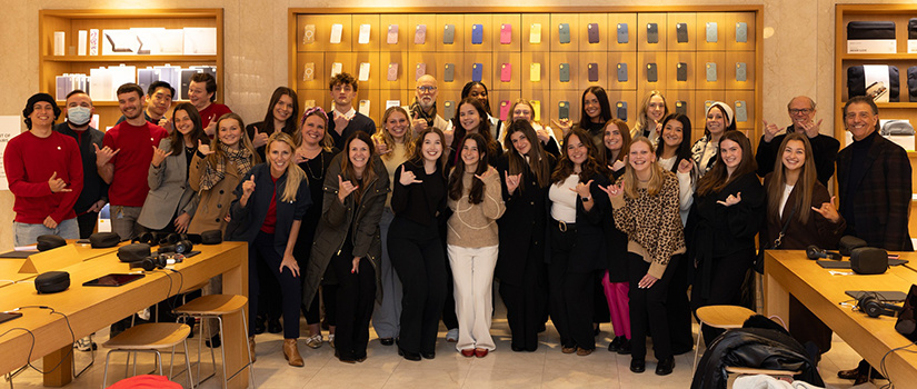 Students, faculty and staff from HRSM pose for a photo at an Apple Store in New York City