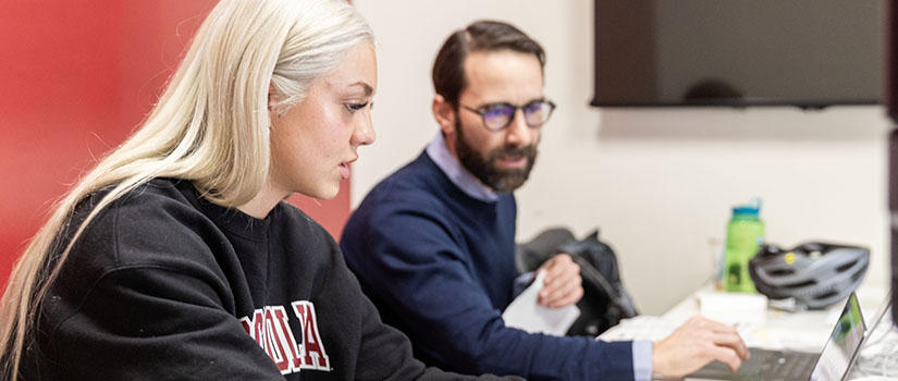 Tax Clinic director with law student working