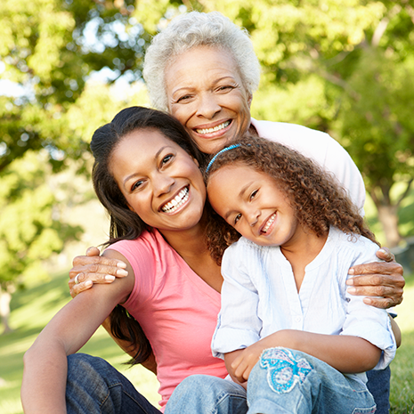 family of three in a field