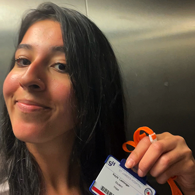 Kayla Lashinger holding photo badge.