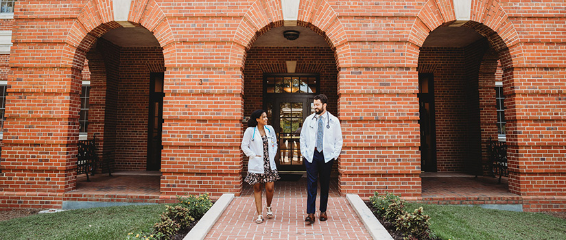 Students in front of building three