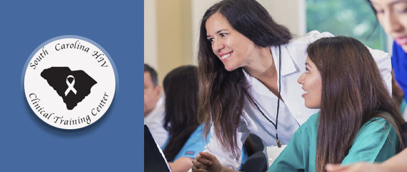 Female professor assisting female student with computer screen in classroom. SC HIV center logo with AIDS ribbon over state of SC on blue background.