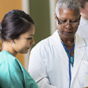 doctor and nurse looking at chart