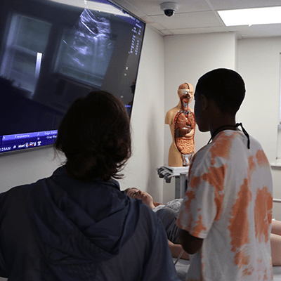 High school students practice ultrasound.