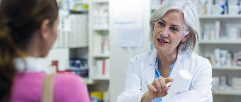 Pharmacist discussing safety with a patient