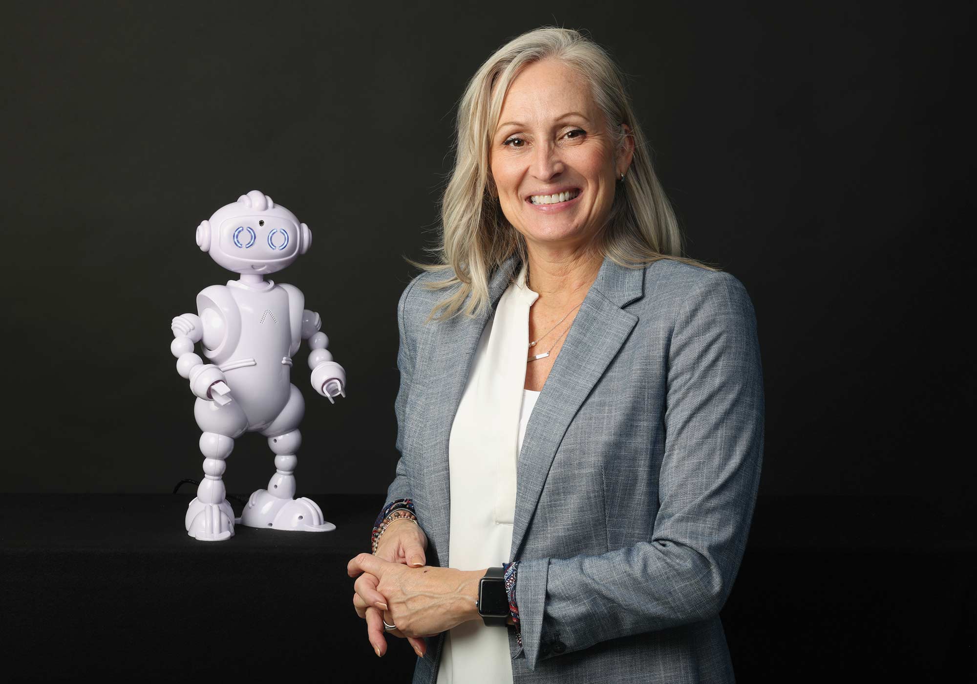 Lauren Boccanfuso fistbumps ABii the educational robot.