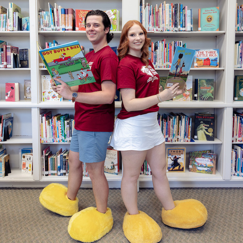 Walker Weaver and Emma Connelly pose with books.